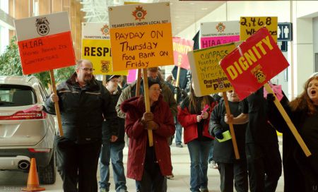 Earlier this month the Eurest cleaners, members of Teamsters Canada, together with other airport workers rallied at the airport to tell the Airport Authority to step up. Now they want your help. Photo Trevor Beckerson, Facebook