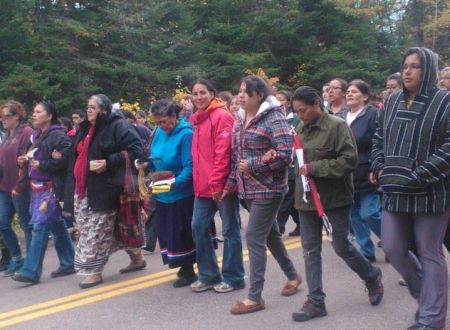 Annie Clair, centre, will be heading to Moncton soon to face charges relating to the violent actions of New Brunswick RCMP against defenders of the land in Kent County, New Brunswick. She needs help paying her legal fees. Photo Facebook