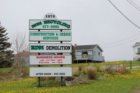 The RDM Recycling facility at 1275 Old Sambro Road has been shut down since January of 2013. Residents would repeatedly try calling the number listed to report after-hours activity, but there would be no answer. {Photo: R. Hussman]