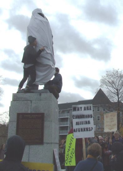 Shameless statue of the genocidaire covered