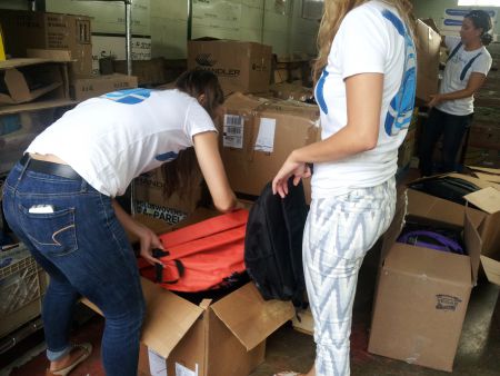 Volunteers pack backpacks at Feed Nova Scotia so they are ready for kids in Nova Scotia going back to school. (Photos: Rebecca Zimmer)