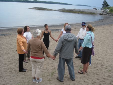 People holding hands for Hands Across the Sand in Point Pleasant Park