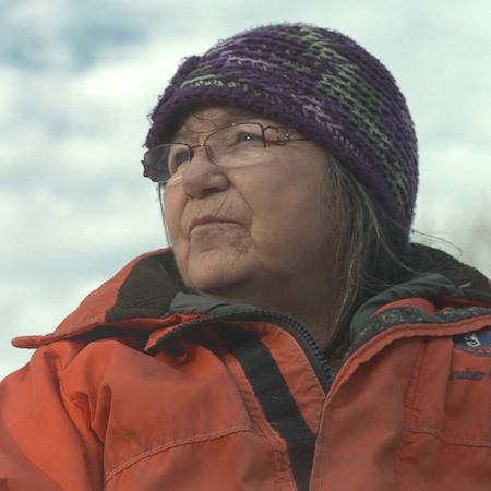 Maliseet elder Alma Brooks on the banks of the Wulustuk (Saint John) River. Photo: Jonathan Hayes, Director of Take Me To The River