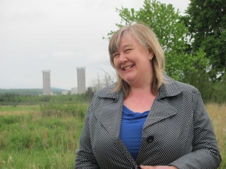 Beth Nixon, spokesperson for the Concerned Citizens of Penobsquis, speaking about the impacts of potash mining and gas exploration and production on her community during a tour of Penobsquis with supporters from Mining Watch Canada and CCNB Action on May 30, 2012. (Photo: Tracy Glynn.)