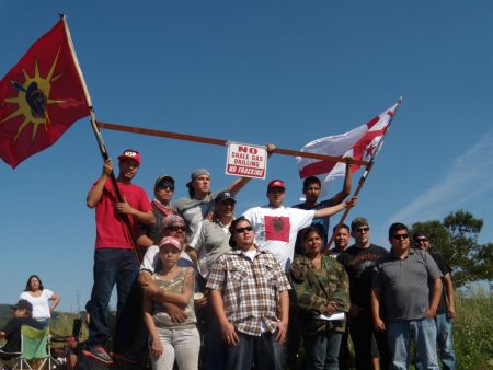 Peter Bernard (front row left), Ginny Marshall (front row centre-right), Emmett Peters (back row far right) and other Mi'kmaq Warriors and supporters at the site of Friday's partial road blockade (Ben Sichel photo).