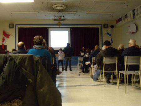 A woman and her daughter speak to HRM moderator Dali Salih about their experiences in the green space opposite Highland Park Junior High. (Photo: Ben Sichel)