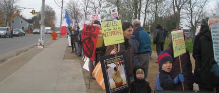 A combination of handmade & printed signs sent the message out; Kings/Hants does NOT want fracking to happen here! Note, on the far left, one person handing out leaflets to passers-by.