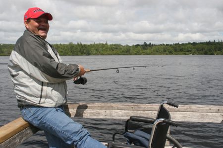 Dwayne Smith casts a line into the water.