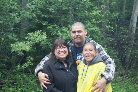 Dorene Bernard, Don Brooks (firekeeper) and Maurina Beadle. [Photo: Miles Howe]