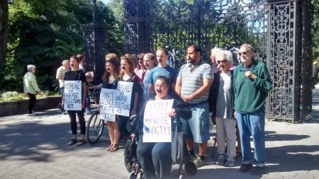 Students and community organizers marched through the Public Gardens to oppose the so-called Fair Elections Act. Photo Moira Donovan