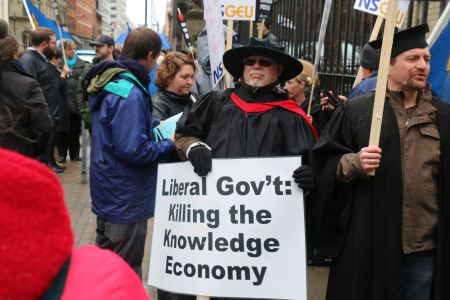 Larry Haiven was amongst about 100 protestors who took to the streets against Bill 100, on April 27th in Halifax. [Photo: M. Howe]