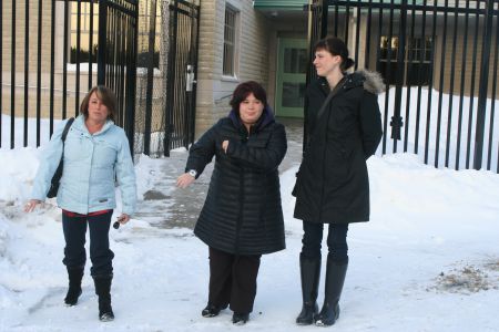 Brenda Hardiman (left) and Nichele Benn (centre) leave the Lower Sackville RCMP detachment where Nichele had her fingerprints taken last week. Photo Robert Devet