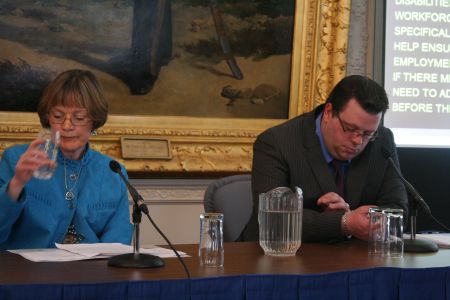 200 people with disabilities may lose their jobs if funding for their support workers is cut off on April 1st. Heather Downey, mother of a child who lacks social skills, and Andrew Stratford, who experiences bouts of anxiety, raise the alarm at a press conference.  Photo Robert Devet