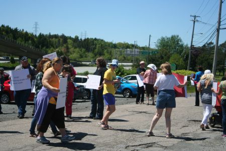 Rally in front of the Quest Rehabilitation Centre in Lower Sackville after a violent death occurred there earlier this summer. Worried protesters wanted information, but Community Services isn't saying much. Community partners are also in the dark about progress of a large transformation project that was announced last year.  Photo Robert Devet