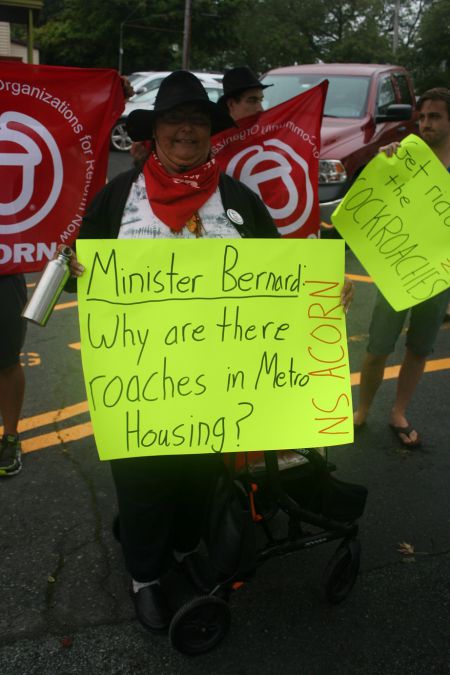 Dartmouth tenants, tired of cockroaches and bedbugs, rally at Community Services minister Joanne Bernard's constituency office in Dartmouth. Photo Robert Devet