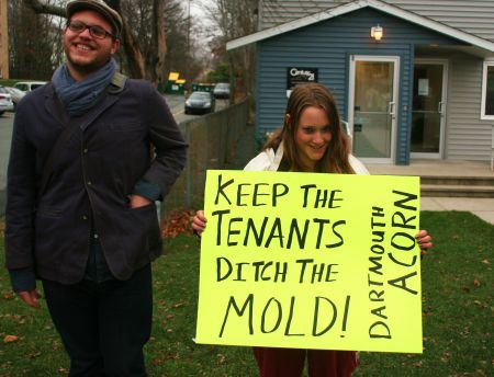 Evan Coole of ACORN Canada and Jessica Basterache, outside Atlantic Living's Dartmouth office. [Photo: Miles Howe]