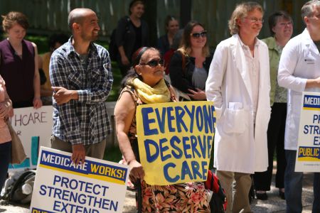 Healthcare and refugee advocates joined forces to protest federal cuts to refugee healthcare, in Halifax and other Canadian cities. Photo Robert Devet 