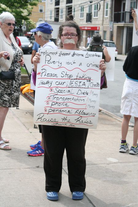 People living in poverty rallied at the Community Services office on Gottingen Street in North End Halifax. They want an end to the two-year long welfare freeze.  Photo Robert Devet