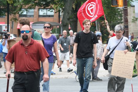 People living in poverty proceed to the Community Services HQ to talk about their fears around a proposed social assistance transformation. Photo Robert Devet