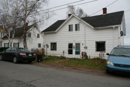 This is the humble duplex shared by John Tyler and Shannon Kieler. Neighbours have submitted sworn affidavits stating that the two are not a couple, but to no avail. Photo Robert Devet 