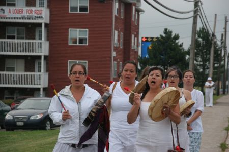 Women in white gathered at the Holiday Inn in Moncton to protest SWN Resource Canada's continued seismic testing in New Brunswick. [Photo: Miles Howe]