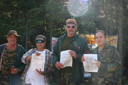 Acadian & Mi'kmaq Warriors 'Romeo', Saulnier, Pictou and Patles hold a copy of the 1778 eviction notice.