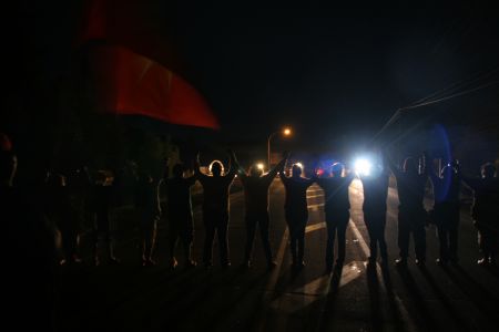 A line of women provided a line between angered activists and a heavy RCMP presence. [Photo: M. Howe]