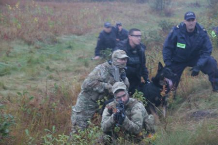 Troops in a semi-circle sweep engaged sleeping campers on the morning of the 17th. ERT members, awake in some cases for over 30 hours, had lethal oversight.[Photo: Miles Howe]