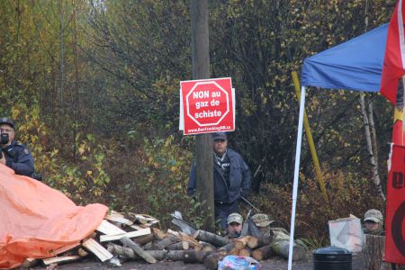 Constable Rob Frennet, with M-16 and cammo mask, was ready to pull the trigger on Germaine Breau on October 17th. His reports of the events, however, grew from vague to detailed following inter-department emails and prompts. [Photo: Miles Howe]