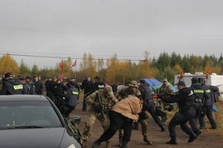 Numerous signs point to Thursday October 17, 2003 being a pre-meditated 'take down' day for the peaceful anti-shale gas encampment along Highway 134. Did the Mi'kmaq Warriors still at camp take the fall? PHOTO: Miles Howe