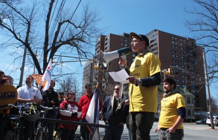 Shay Enxuga speaks at the rally outside Just Us! (Photo by Hilary Beaumont)