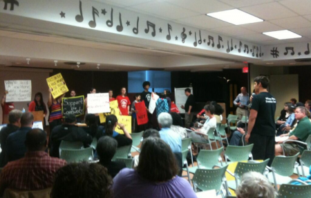 Kitpu kids hold up signs. (Photo by Hilary Beaumont)