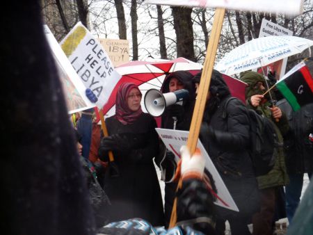 Sixty people stood in the rain to declare solidarity with Libyans fighting for freedom. // photo by Moira Peters