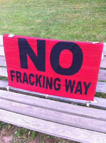 One of several NO FRACKING signs outside the Port Hawkesbury meeting (Photo: Liv Bochenek)