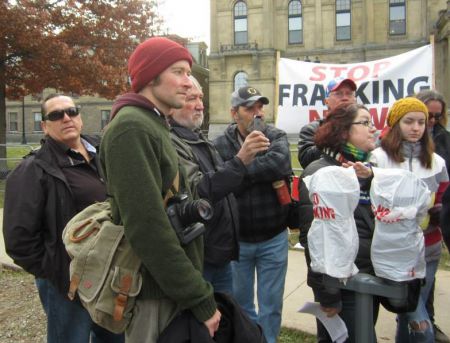 Halifax Media Co-op journalist Miles Howe at an anti-fracking rally.  Howe was arrested three times while covering shale gas protests in New Brunswick.  All charges have now been dropped.  Photo: Patty Crow