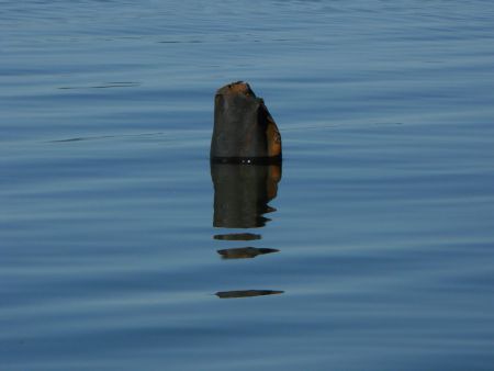 Remnants of earlier oil exploration on a sandy shoal on the west coast of Newfoundland. Erosion kicked in and leaks and pipes sticking out of the water is all that remains.  Photo Bob Diamond