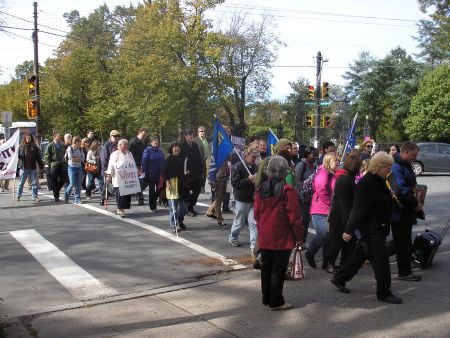 The 150 attendees walked from Victoria Park to Saint Matthew's Church, where they heard a panel discussion on poverty (Robert Devet photo).