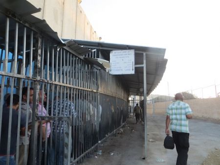 Armed checkpoints and roadblocks are part of the Israeli occupation of Palestine. The checkpoints restrict the travel of Palestinians between cities and towns. Photo by Ruth Breen.