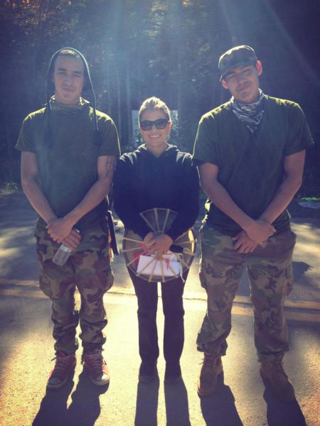 Concert organizer Shelley Young flanked two young warriors in Elsipogtog.  (Left to right, Aaron Francis, Sheley, Young, Chase Gould).  Photo: Nina Starr