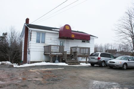 The exterior of the club and Grow-Op Shop, previously a tanning salon. (Photo by Hilary Beaumont.)