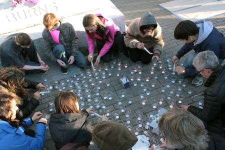 Young people lead the candle lighting. (Photo by Hilary Beaumont)