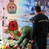 CUPW members laying a wreath