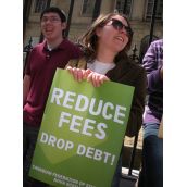 Students yelled "Fuck high fees" and held signs saying "Reduce Fees, Drop Debt" 