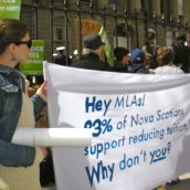 Sign reads: "Hey MLAS: 83% of Nova Scotians support reducing tuition fees. Why don't you?"