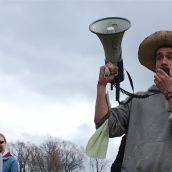 Aaron Beale, a protest organizer, reminds everyone to say "No!" to corporate control of food.