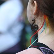 Artsy feather and earring shot. Photo: Miles Howe