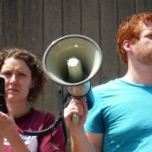 Palmira Boutlier and Kyle Buott hold the megaphone to Miles Howe, reporting via Skype.