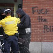 Cops issuing a ticket for "riding a bicycle on the sidewalk". The Roger's store in the background isn't thrilled.