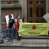 Protesters confront Clement on Hollis St. in Halifax.