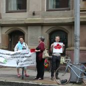 Protesters confront Clement on Hollis St. in Halifax.